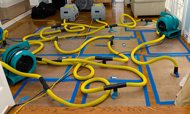 Professional Flood Damage Restoration technician working in Lithopolis, OH